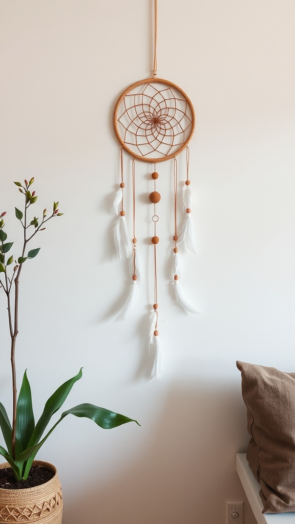 A decorative dreamcatcher with a wooden frame, white feathers, and brown beads, hanging on a wall next to a plant.