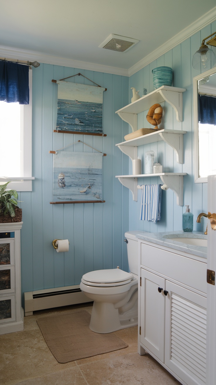 Coastal bathroom with blue walls and nautical artwork.