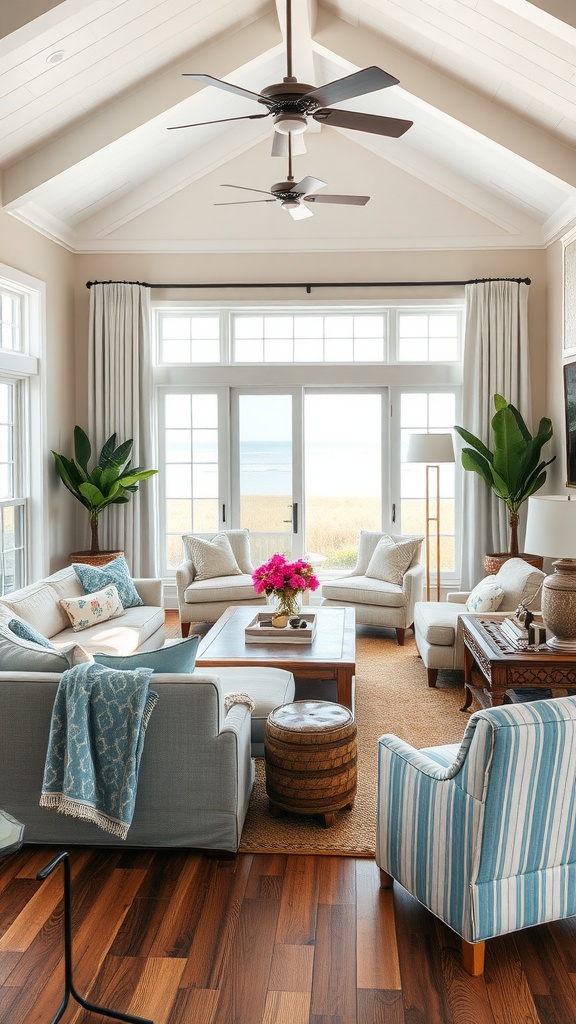 Coastal living room with gray sofas, striped accent chair, and large windows.
