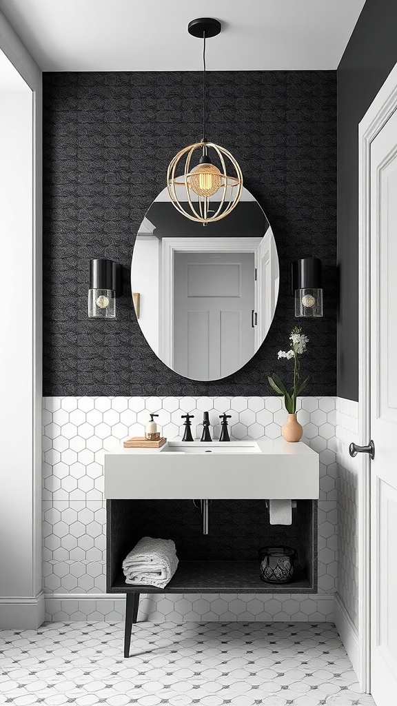 A modern bathroom featuring sculptural lighting fixtures above a sink with a mirror, accented by black and white penny tiles.