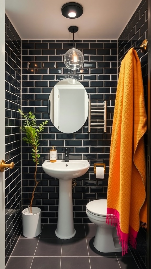A stylish bathroom featuring black subway tiles, an orange towel, a plant, and modern fixtures.