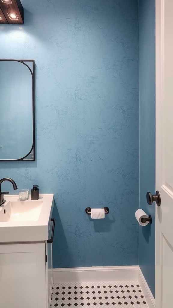 A blue bathroom with textured walls, white sink, and black fixtures.