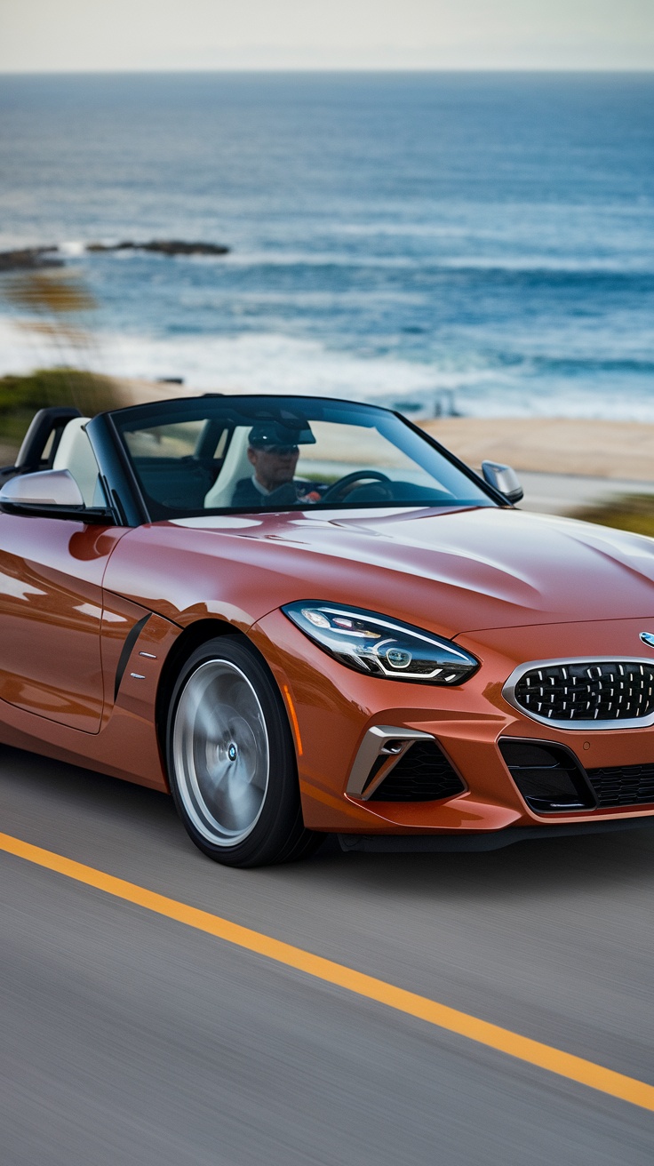 A BMW Z4 convertible driving along a coastal road.