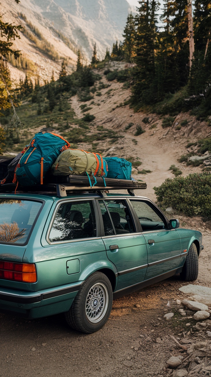 BMW E30 Touring parked on a dirt road with camping gear on the roof.
