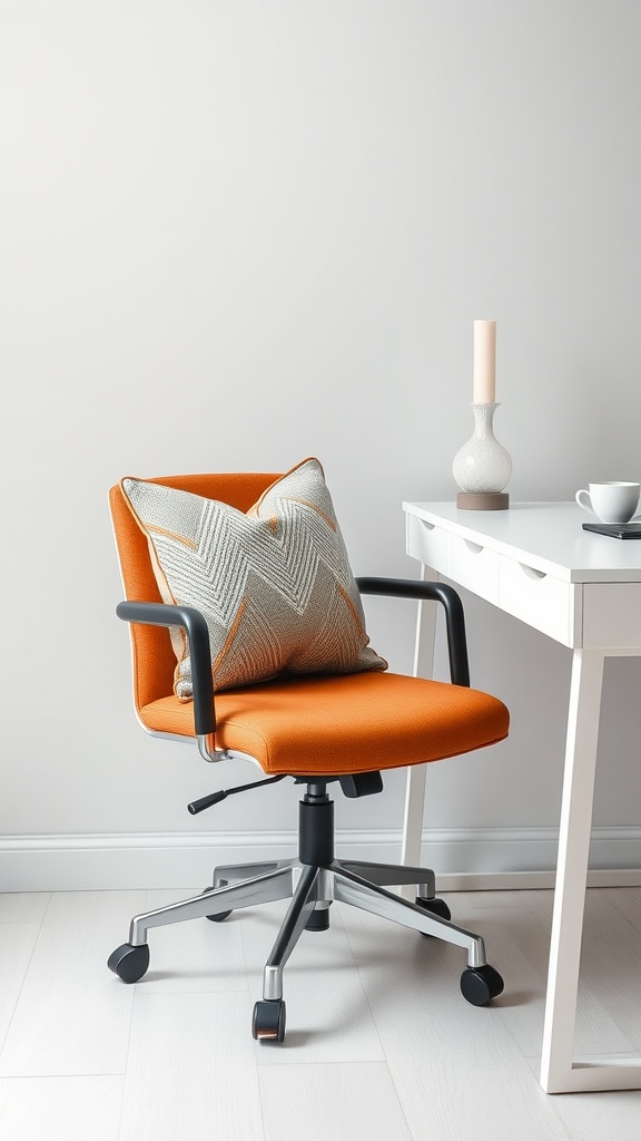 An orange office chair with a decorative cushion, next to a white desk and a candle