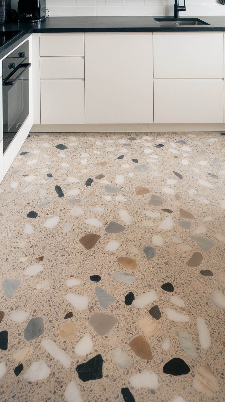 A modern kitchen featuring a classic terrazzo floor with various colored stone chips and sleek cabinetry.