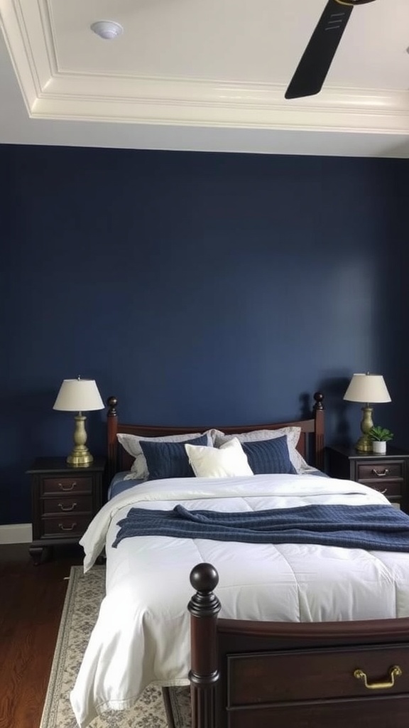 A cozy bedroom with a dark blue accent wall, white bedding, and wooden furniture.