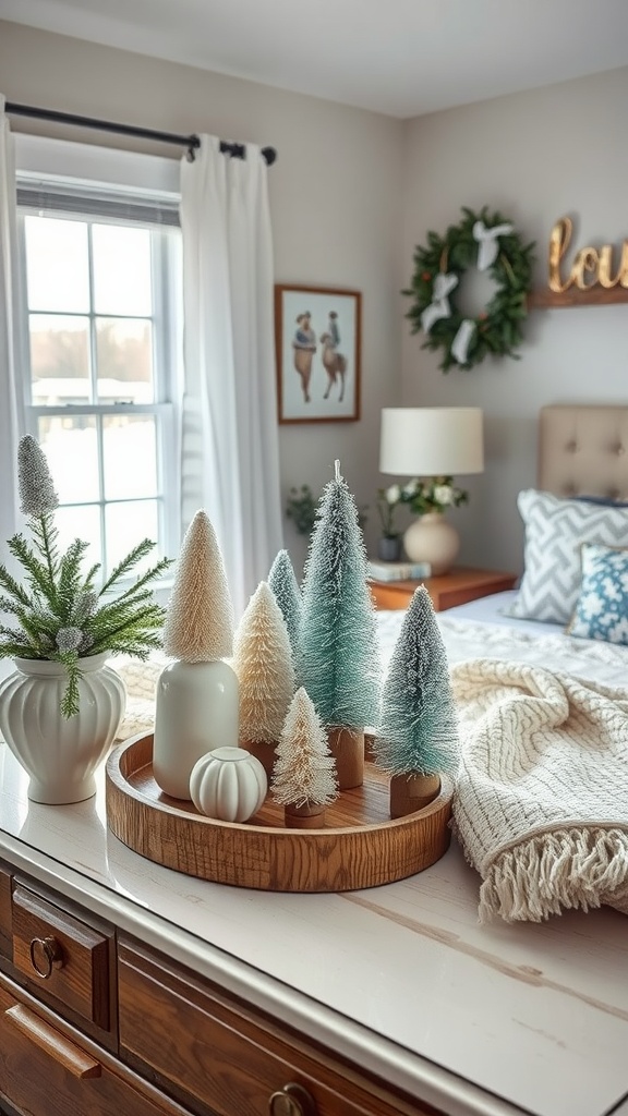 A winter-themed bedroom with a decorative arrangement of bottle brush trees and cozy textiles.