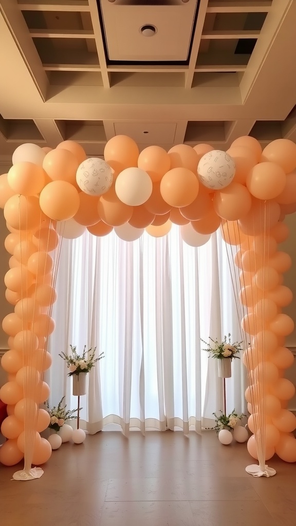 A beautiful balloon garland in peach and white colors, creating a cheerful decoration for a baby shower.