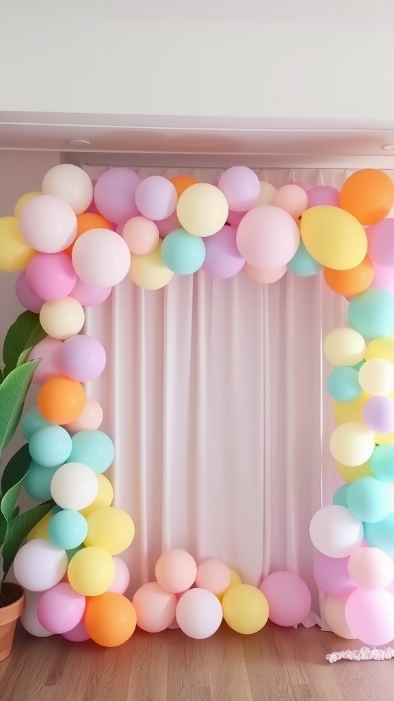A colorful balloon garland installation for a baby boy shower, featuring pastel and bright balloons arranged in an arch.