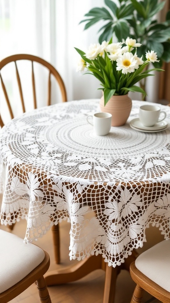 A classic round crochet tablecloth on a wooden table with a flower pot and two cups.