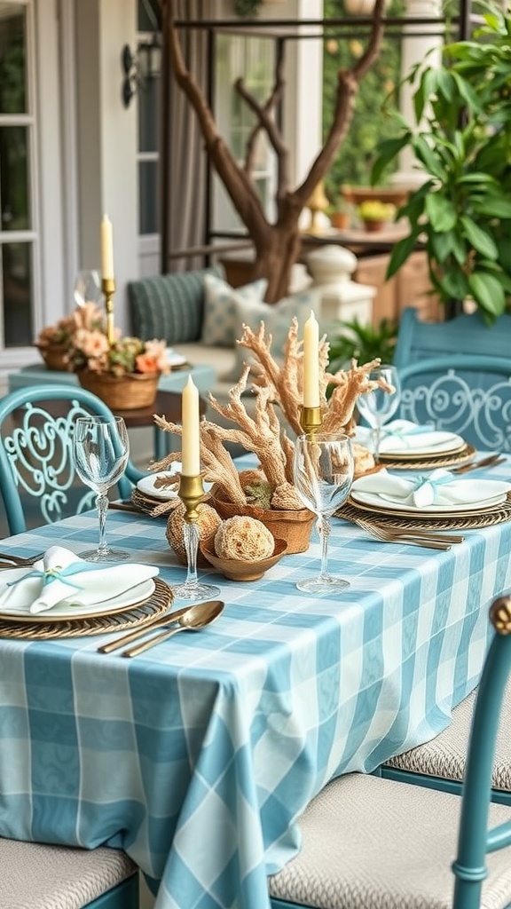 A coastal-themed table setting with a blue checkerboard tablecloth, coral centerpiece, candles, and elegant tableware.
