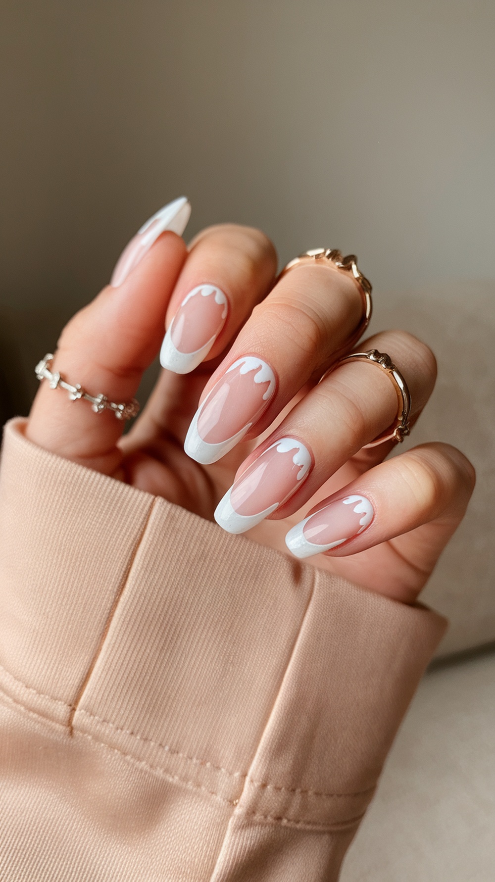 Nails with ghostly white tips and a drip effect