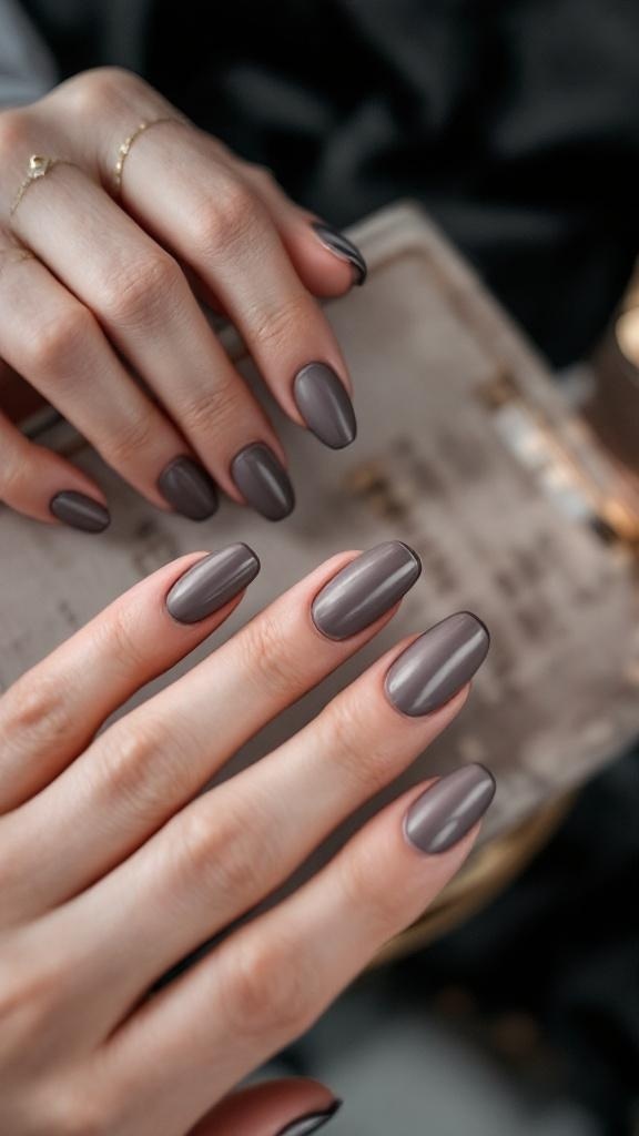 Nails with a matte pink finish and glossy white tips, featuring delicate designs and rings.