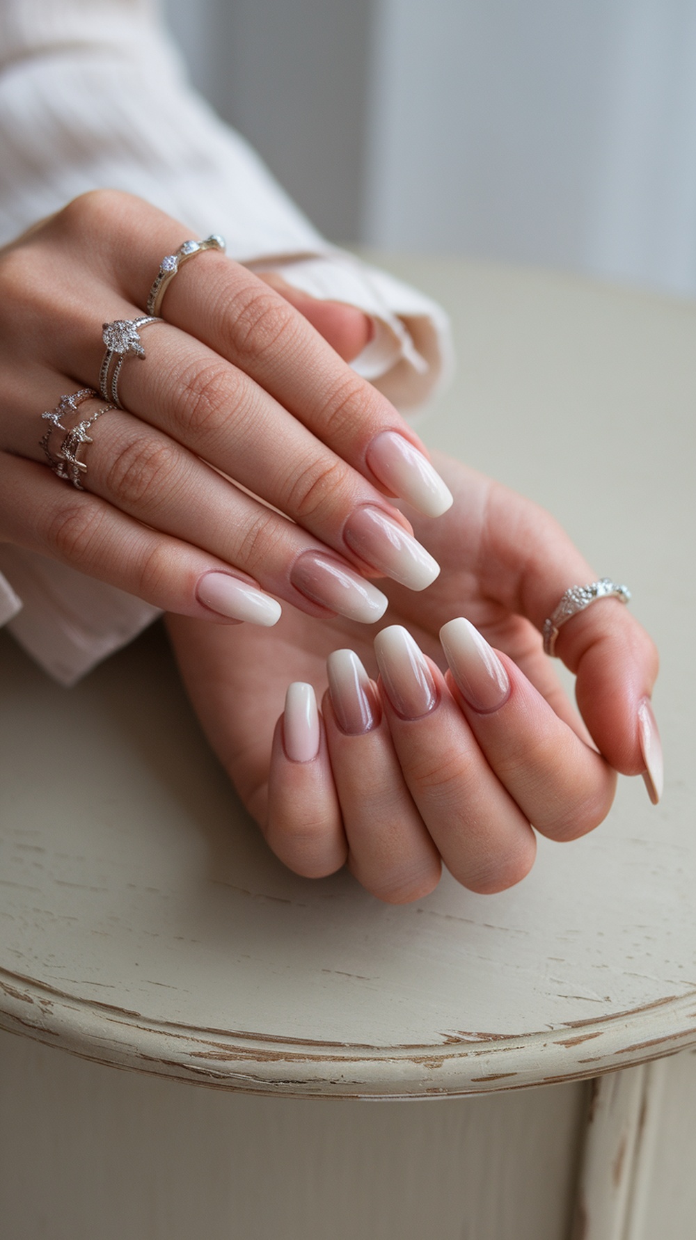 Nails with ombre effect in soft browns, showcasing a smooth gradient from light to dark.
