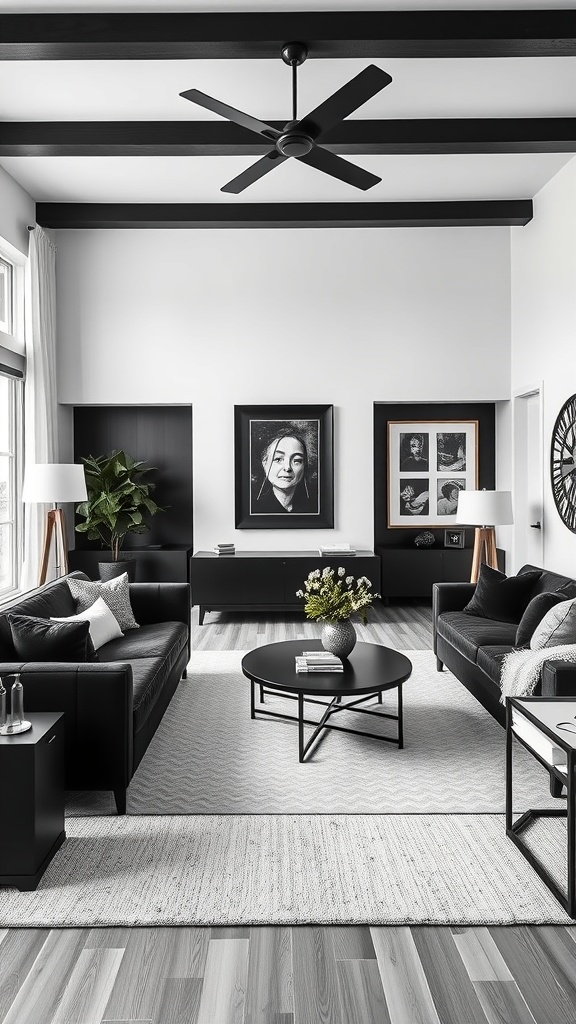 A stylish black and white living room featuring black sofas, a round coffee table, and framed artwork on the walls.