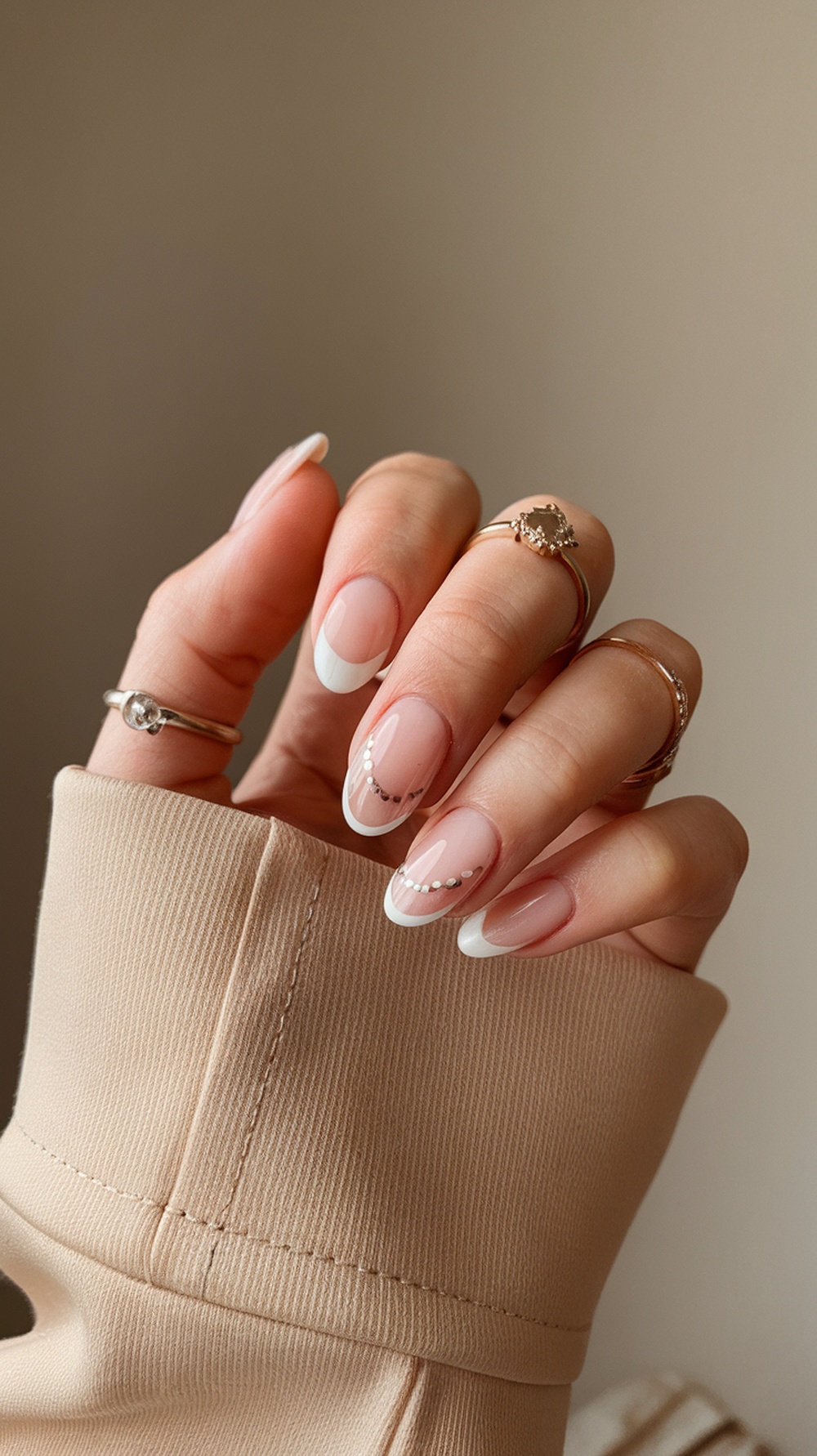 Elegant nails with white tips and dotted design, inspired by sunflowers.