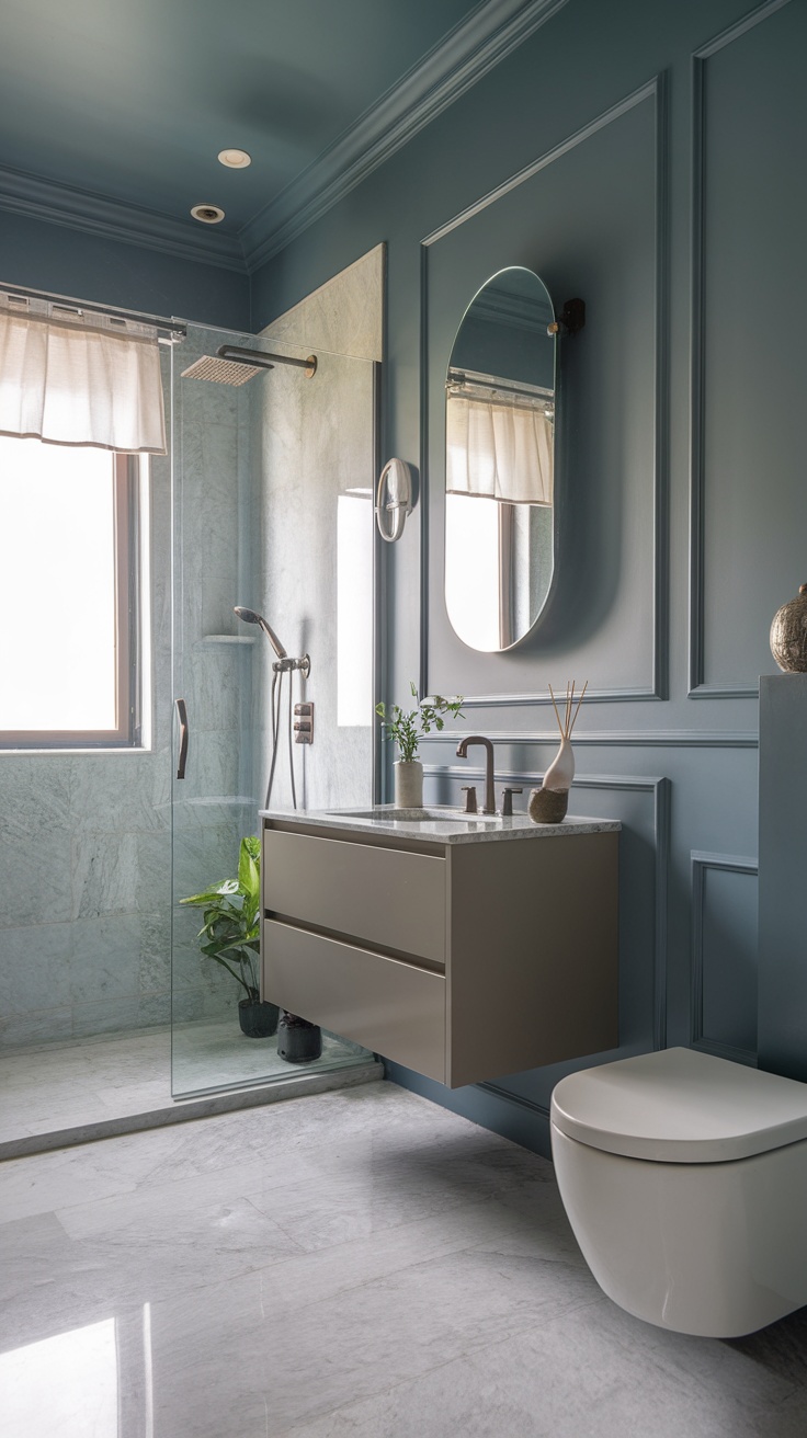 A modern bathroom featuring grayish blue walls, a sleek vanity, and natural elements.