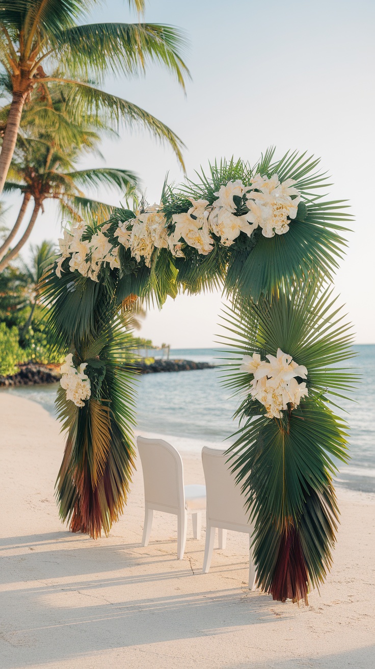 Palm leaf wedding arch on a sandy beach with ocean view