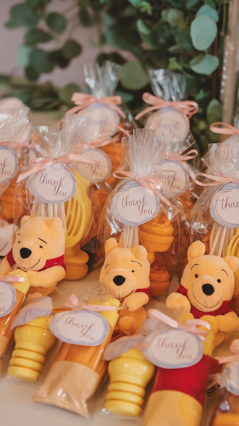 Winnie the Pooh themed baby shower favors with plush toys and honey pots