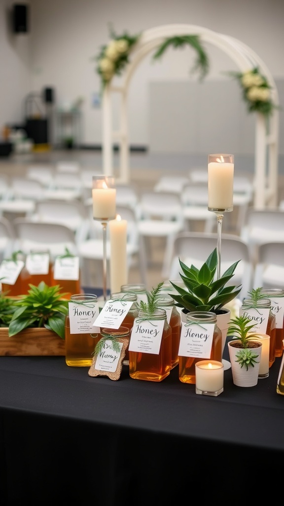 Display of honey jars with labels, small plants, and candles on a black table for a wedding.