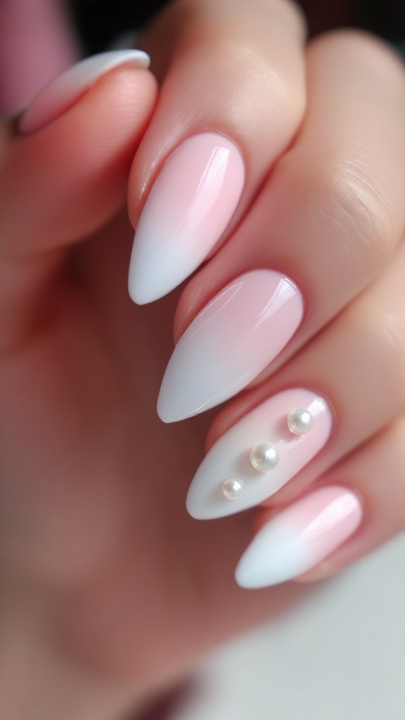 Ombre wedding nails with pearl accents, showcasing a gradient from pink to white.