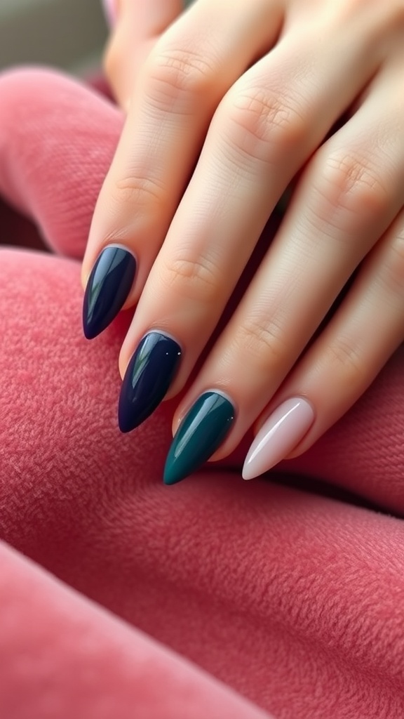 Close-up of hands with nails painted in vibrant jewel tones, including deep blue, green, and soft pink.