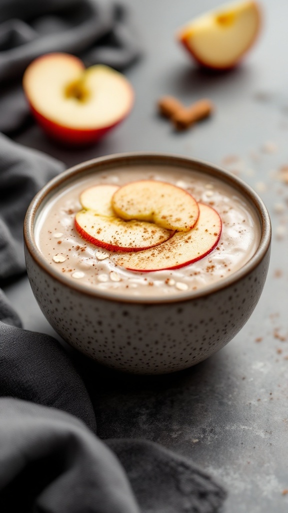 A bowl of Apple Cinnamon Oat Smoothie topped with apple slices and cinnamon.