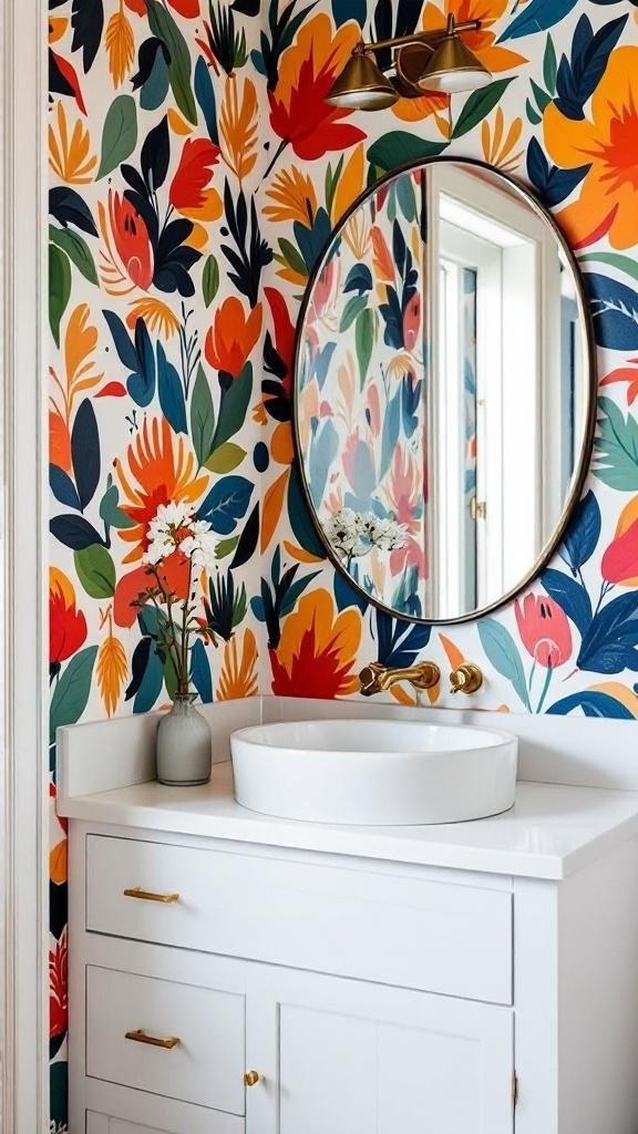 A vibrant bathroom with bold floral wallpaper, a round mirror, and a sleek white sink.