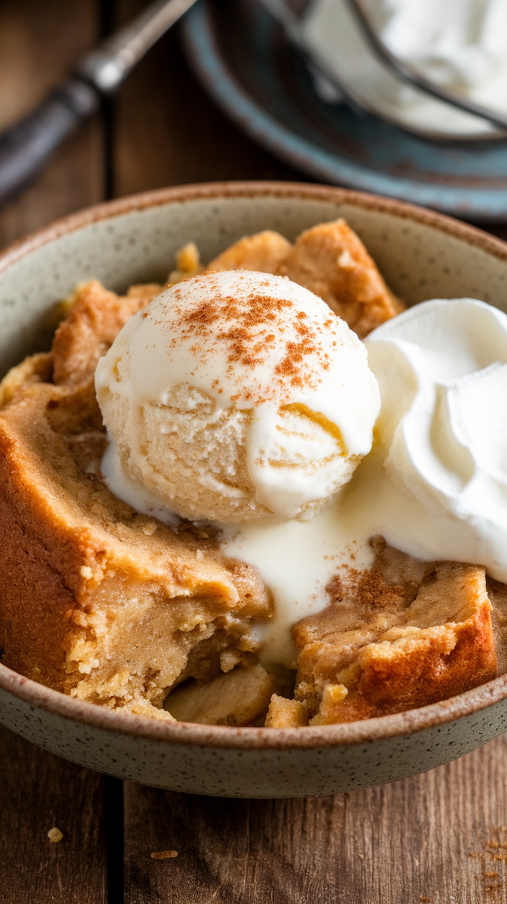 Delicious banana bread pudding served with ice cream and whipped cream.