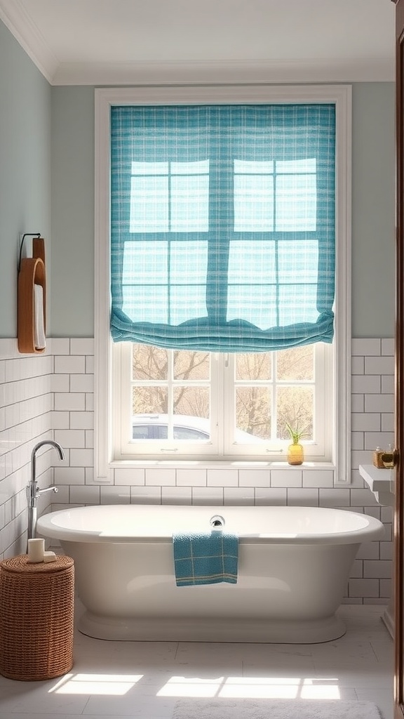 A light blue roman shade covers a window in a modern bathroom with a white bathtub and tiled walls.