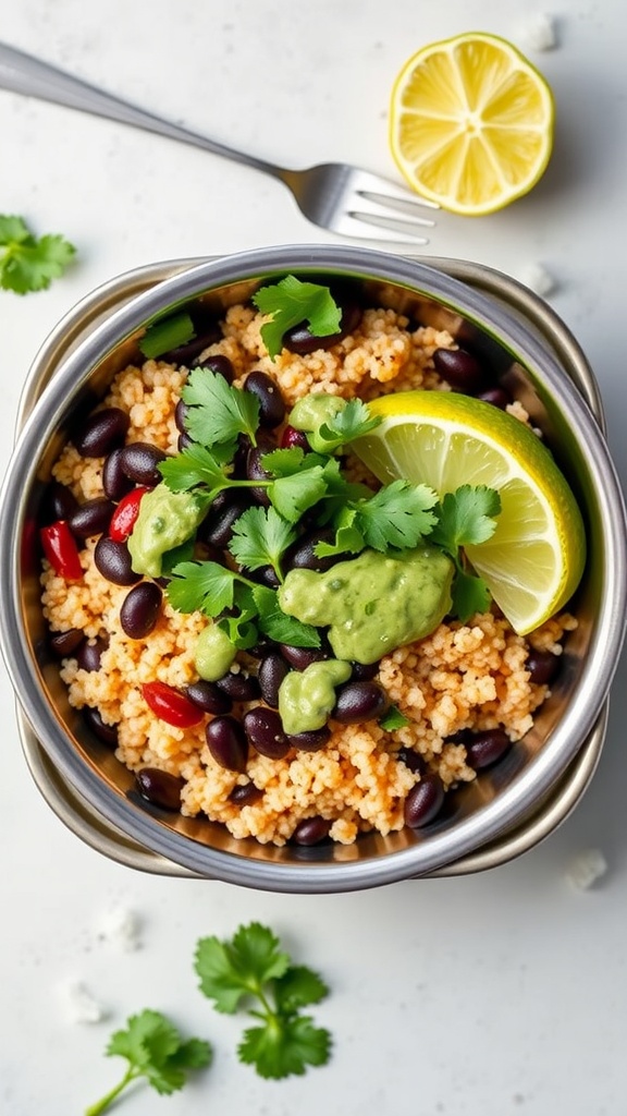 A colorful quinoa and black bean bowl with lime dressing, garnished with cilantro and served in a lunchbox.