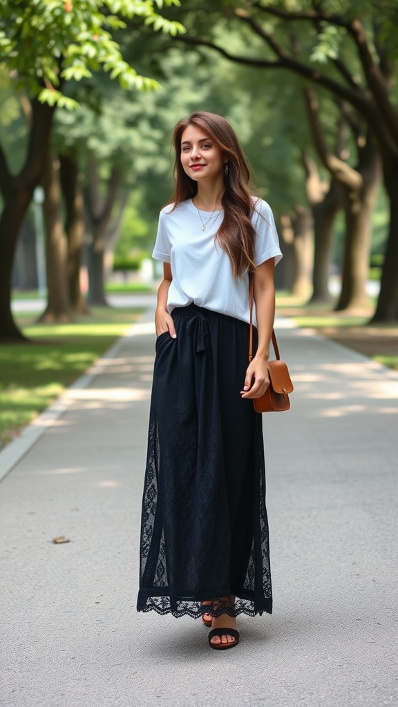 A woman wearing a black lace maxi skirt and a white t-shirt, walking along a tree-lined path.