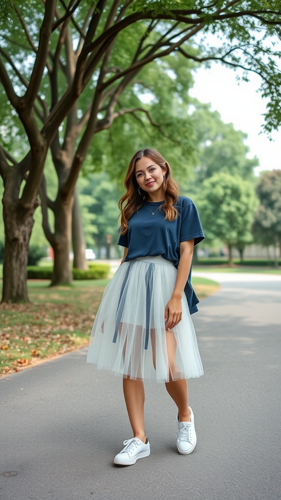 A woman wearing a navy top and a light tulle skirt, walking in a park with trees.