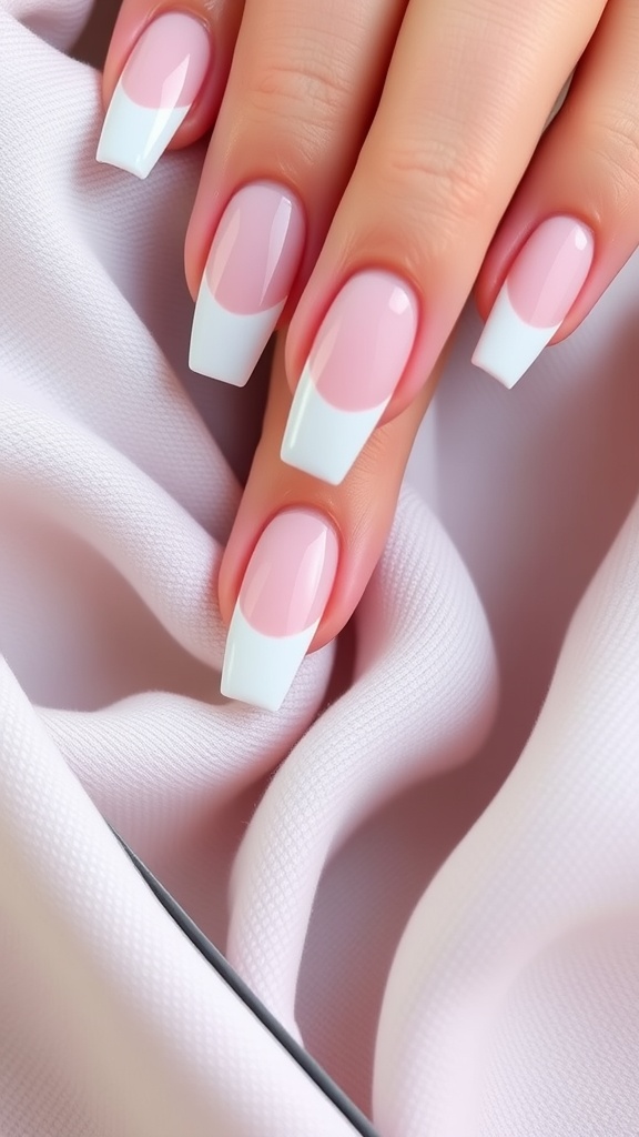 Medium coffin nails featuring a classic French tip design with a soft pink base and a curved white tip.