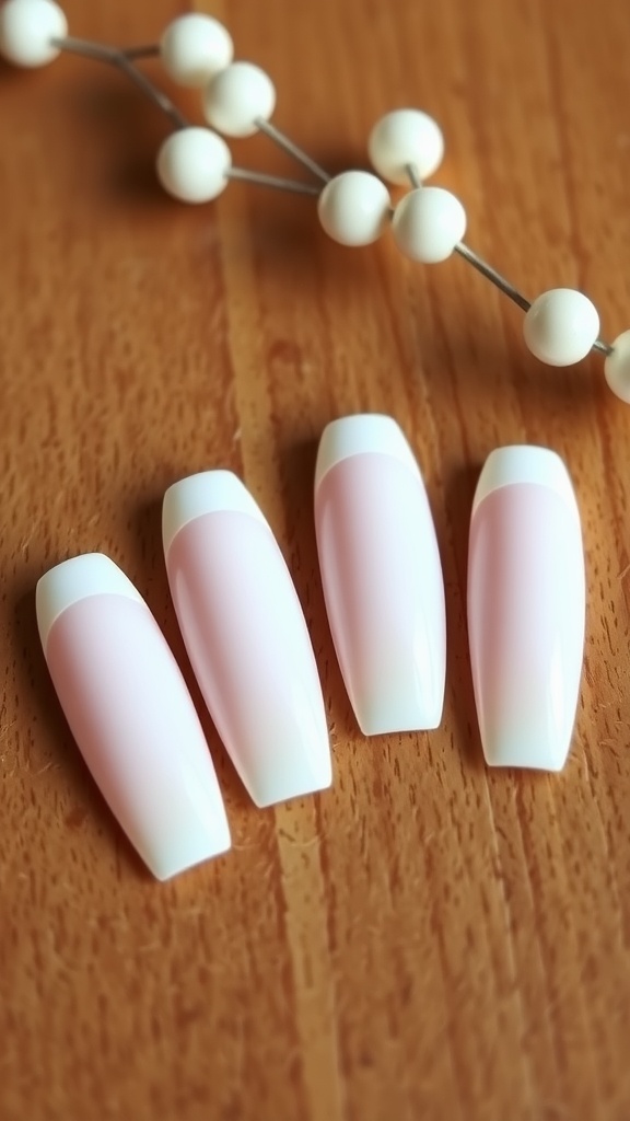 Almond-shaped nails with classic French tips on a wooden surface