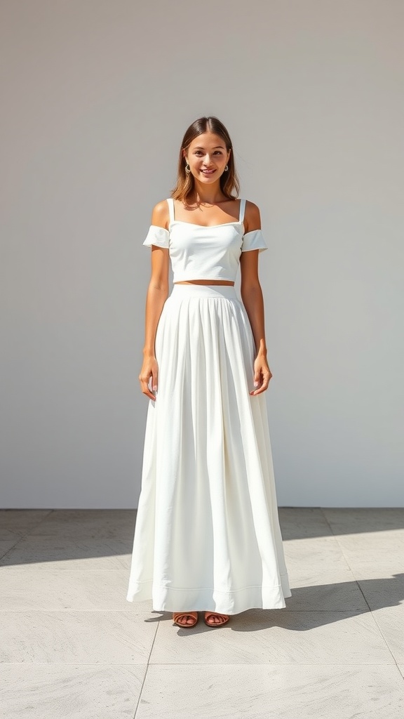 Model wearing a white maxi skirt and white crop top, showcasing a monochrome outfit.