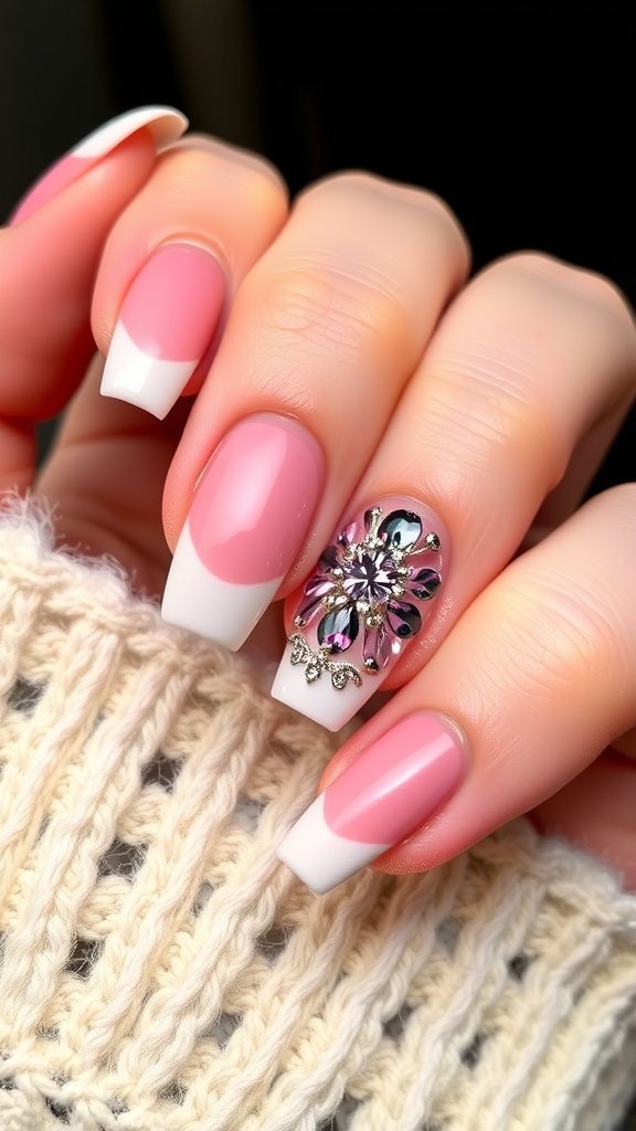 Nail design featuring pink base with white French tips and a decorative gem accent on one nail.