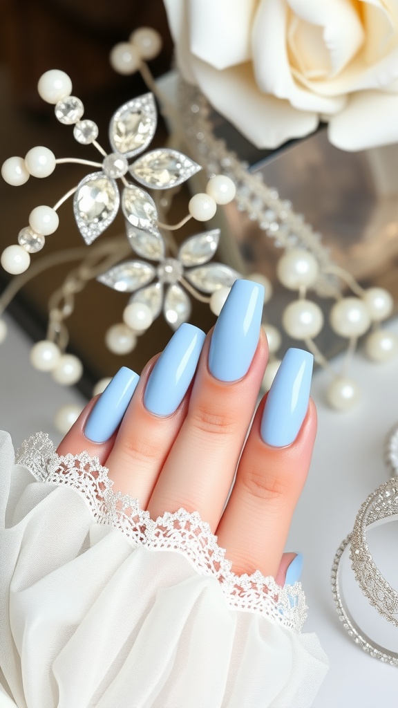 Close-up of light blue chrome nails with elegant accessories
