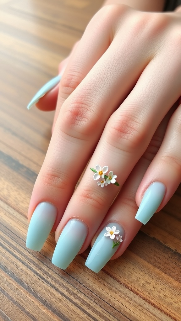 Light blue chrome nails with floral accents