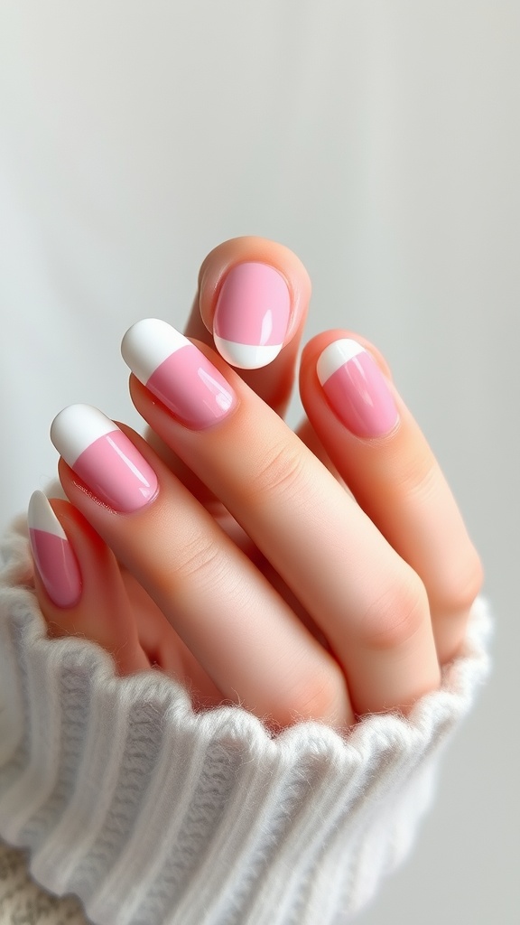 Light pink chrome nails with white tips, showcasing a stylish French twist.