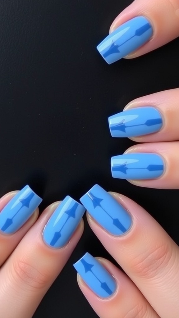 Nails with geometric blue French tips featuring sharp designs.