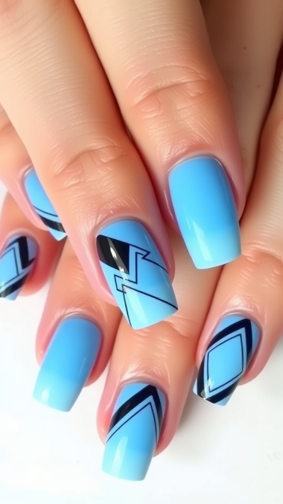 Nail design featuring geometric patterns in light and dark blue colors with black accents.