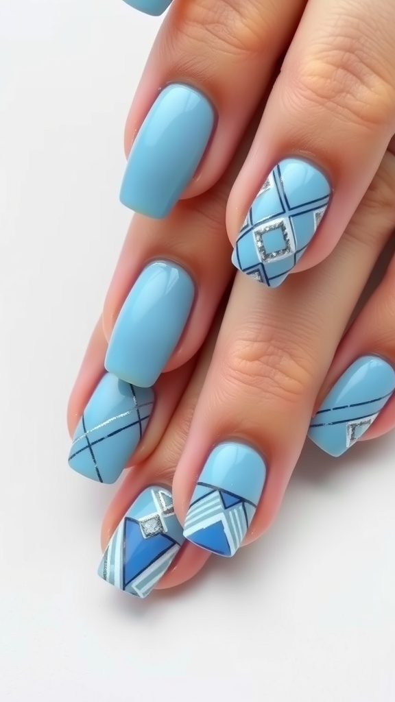 Light blue nail art featuring geometric patterns and metallic accents