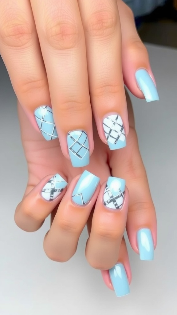 A set of light blue chrome nails with geometric patterns.