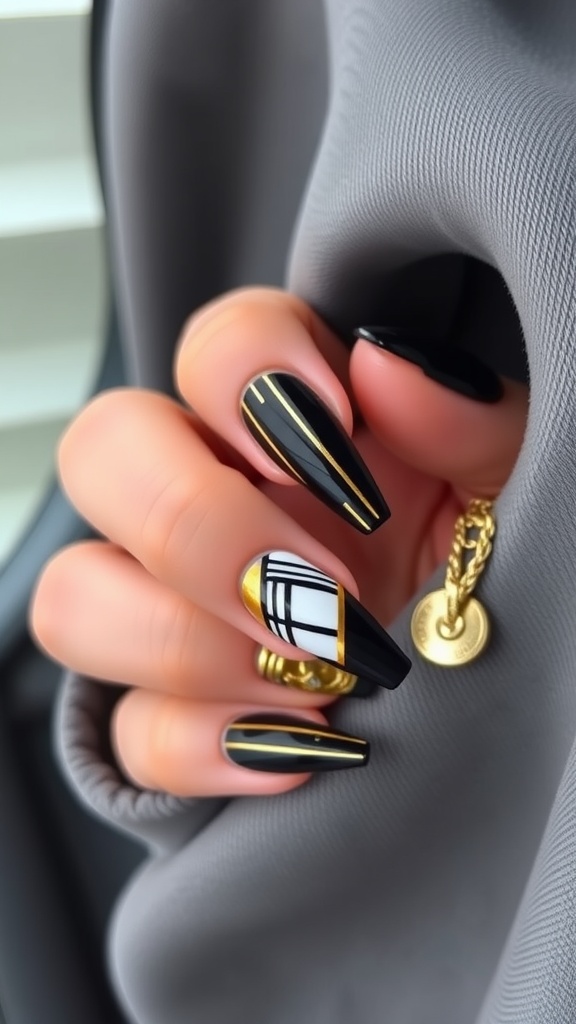 Close up of nails featuring black and gold geometric patterns with French tips