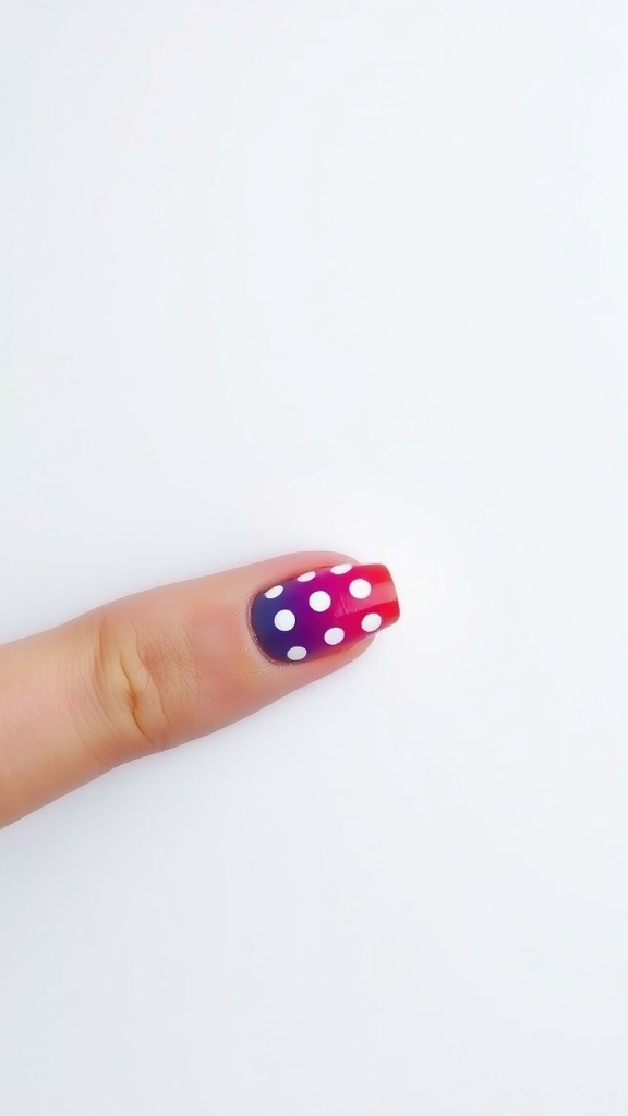Nail with red to purple gradient and white polka dots