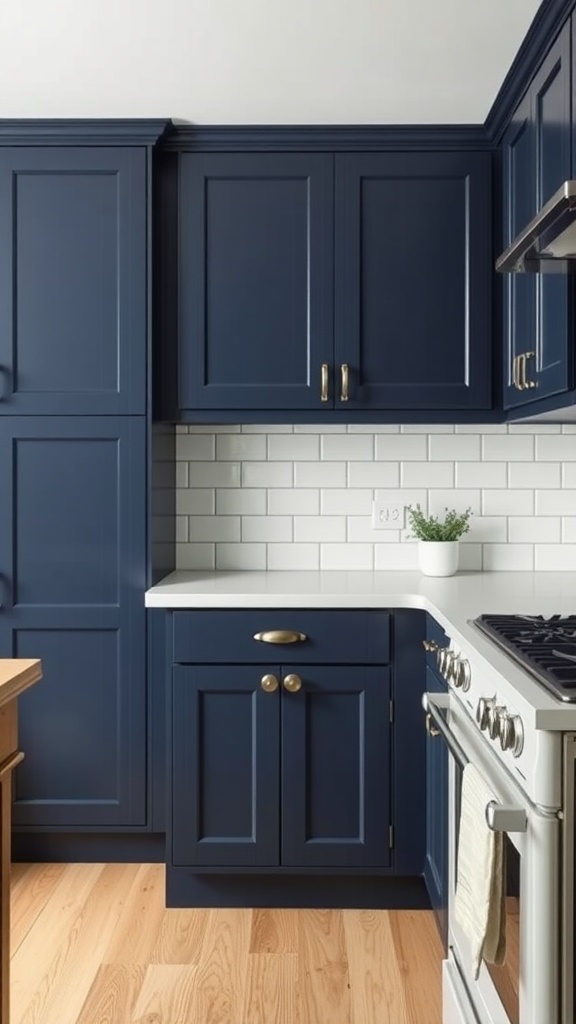 A traditional kitchen featuring navy blue cabinets with gold hardware, white countertops, and a small plant on the counter.
