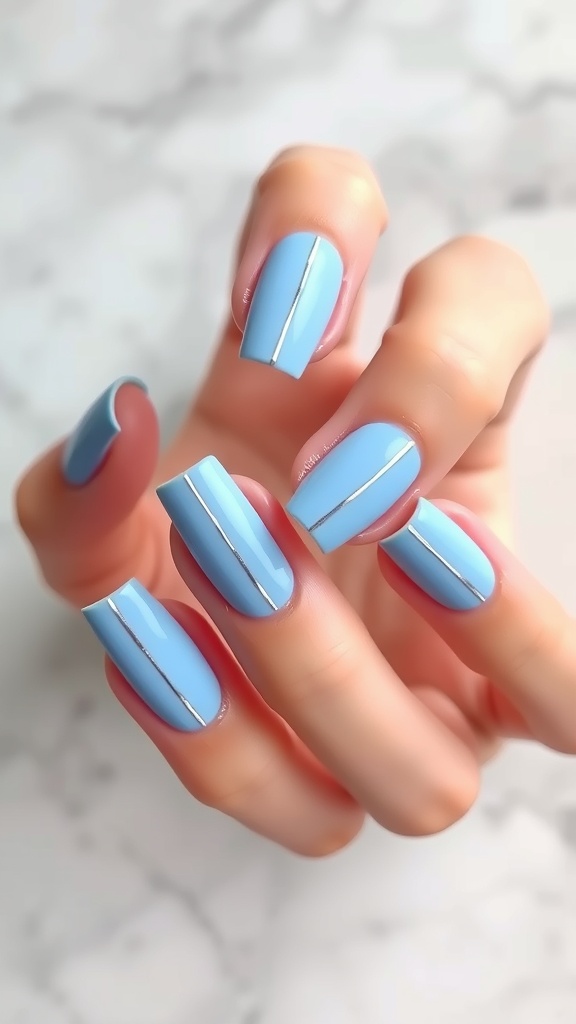 Light blue nails with silver stripes