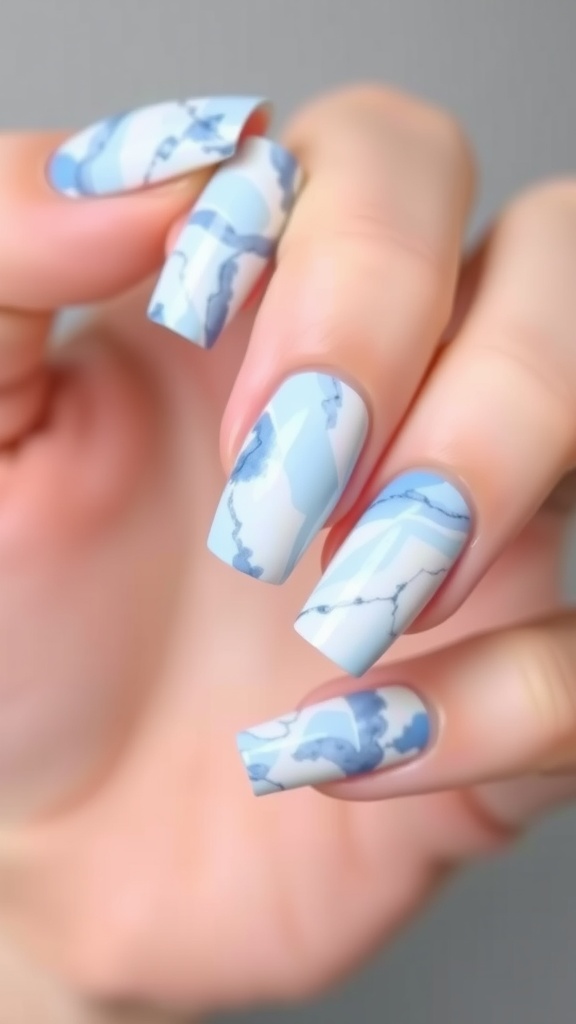 Close-up of light blue marble effect nail art